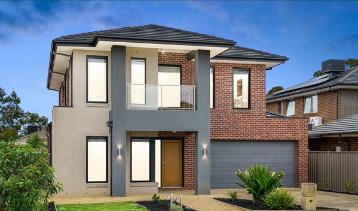 Two-storey Keysborough home repainted with charcoal render and timber-toned door